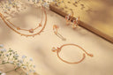 Rose gold heart-shaped pendant necklace with diamonds on an 18k gold chain featuring tassel detail luxury jewelry