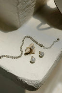 Jewelry, including ring, bracelet, and earrings.