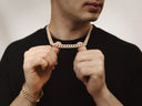 Gold jewelry featuring a gold-colored thick cuban link chain necklace and matching bracelet in art gold style