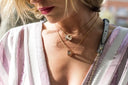 Gold-toned Bvlgari Serpenti necklace with interlocking circular pendants crafted in 18k gold fine jewelry.