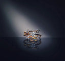 A delicate gold engagement ring with sparkling diamonds in a floral design featured by art gold jewelry.