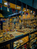 Gold jewelry display featuring intricate art gold designs with vibrant gemstones at a local everett jeweler