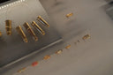 Gold finger rings featuring intricate designs and embedded gemstones representing fine jewelry and art gold styles
