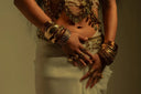 Elegant gold and silver belly dance costume with intricate art gold jewelry designs