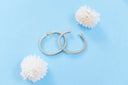 Silver twisted cable hoop earrings with gold-tone clasps showcasing art gold jewelry by david yurman