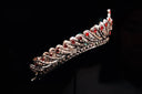 An ornate silver tiara with red rubies and diamonds showcasing fine jewelry craftsmanship in the curse of famous gems.