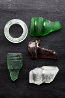 A group of glass pieces sitting on top of a table