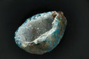 Translucent blue and white cursed gem geode with crystalline interior