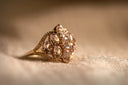 Custom 18k gold ring with oval pink gems in braided art gold jewelry design
