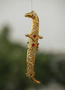 Ornate golden dagger with red jewels