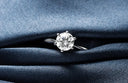 Custom gold diamond ring with sparkling round-cut solitaire in platinum band