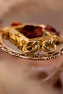 Pair of romantic 18k rose gold knot earrings in custom gold jewelry