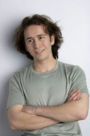 Man in light gray t-shirt with David Yurman 18k gold jewelry