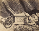 White ornate box with intricate floral carvings and decorative crown top showcasing fine jewelry art gold craftsmanship