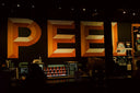 A stage with a large sign on it that says pee