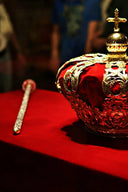A regal gold crown with intricate filigree and red velvet interior, symbolizing gold legacy in everett jewelry store collections