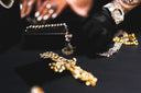 A gleaming art gold chain with intricate links and diamond accents illustrating fine jewelry financing options