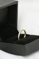 18k gold ring with sparkling diamonds in black gift box