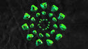 Vibrant green cursed gems in art gold jewelry radial pattern