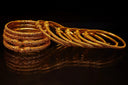 Intricately engraved 18k gold bangles, custom gold trend for engagement rings