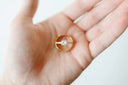 Stunning 18k gold engagement ring with diamonds in open palm