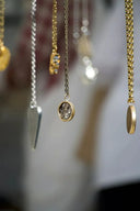 Delicate handcrafted 18k gold pendant necklaces by Rinaldo Borges