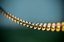 tilt shift photography of gray steel chains