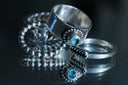 Silver 18k gold ring with faceted blue gemstone in luxury jewelry