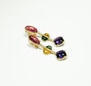 Elegant gold-tone drop earrings with vibrant gemstones showcasing handmade gold jewelry luxury and style.