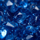 Faceted blue gemstones with sharp edges and reflective surfaces in fine jewelry inspired by gemstone legends and art gold.