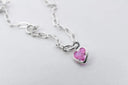 Silver necklace with pink heart pendant in statement jewelry
