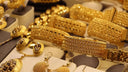 Golden 18k gold bracelets with intricate patterns and gemstones featured at everett jewelry store for engagement rings.