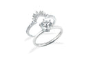 A silver-toned engagement ring with a round-cut diamond and crown-like design in fine jewelry and art gold style.