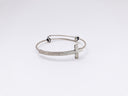 Stunning 18k gold silver-toned bangle with textured cross pendant