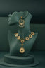 A necklace and earring on display on a mannequin