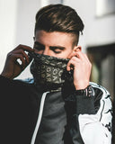 Black face mask with repeating white car lettering pattern complements fine jewelry and art gold styles in heritage and innovation.