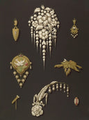 A delicate silver floral brooch with intricate leaf and pearl embellishments in fine jewelry evolution.