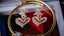 a close up of a pair of heart shaped earrings