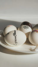 Fabergé eggs with celestial spark patterns in white decor