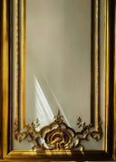 Fabergé golden ornate mirror frame with intricate floral motifs in luxury jewelry