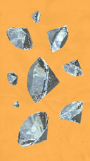 Faceted clear cursed gems scattered on an orange background relating to famous cursed gems and art gold jewelry