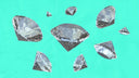 Faceted silver-colored gemstones with reflective crystalline surfaces featured in fine jewelry inspired by ancient art gold styles