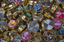 Gold-rimmed cartoon charms from famous jewelry heists.