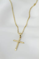 Gold cross pendant and matching chain in 18k gold showcasing fine jewelry and gold jewelry purity differences