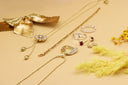 Gold chain necklace with diamond-studded heart pendant and dangling beads inspired by Cleopatra royal jewels and art gold jewelry