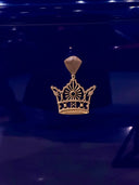 Diamond crown with a gem on a blue background.