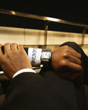 Sleek Cartier Santos watch in art gold jewelry on wrist