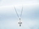 silver and diamond studded cross pendant necklace
