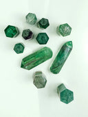 Green hexagonal crystal points in art gold jewelry