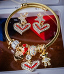 Gold-toned art deco cable bracelet with rhinestone heart and star charms